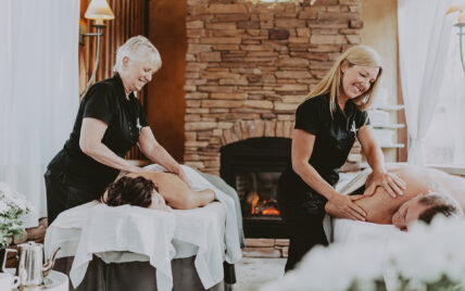 Two people getting massaged at Niagara's Finest Hotels in Niagara-on-the-Lake.