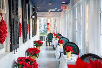 Poinsettia bouquets on tables as part of the Christmas Wonderland Package.