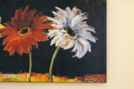 Paint of a red flower and a white flower on the wall at The Charles Hotel in Niagara-on-the-Lake.