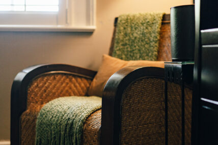 A chair with a blanket on it in the Magnolia Room at The Charles Hotel in Niagara-on-the-Lake.