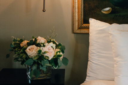 Flowers on a nightstand in the Magnolia Room at The Charles Hotel in Niagara-on-the-Lake.