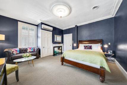 The bedroom in the Poppy Room at The Charles Hotel in Niagara-on-the-Lake.