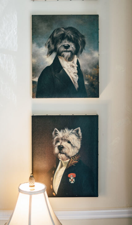 Art pieces of dogs heads on human bodies at The Charles Hotel in Niagara-on-the-Lake.