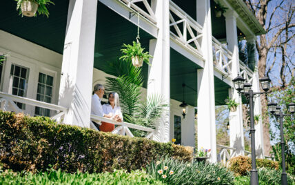 A couple on a porch at The Charles Hotel in Niagara-on-the-Lake.