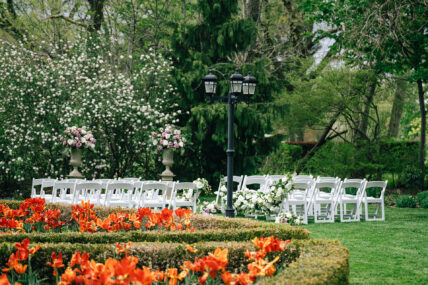 A view of a garden and an outdoor wedding at The Charles Hotel in Niagara-on-the-Lake.