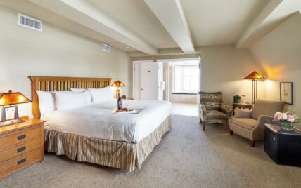 Wine and snacks on a bed in the Honeymoon Suite at Harbour House Hotel in Niagara-on-the-Lake.