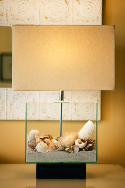 A lamp with sand and shells in it at Harbour House Hotel in Niagara-on-the-Lake.