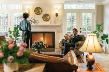 Two people together in a living room at Harbour House Hotel in Niagara-on-the-Lake.