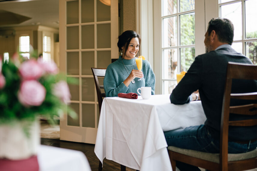 A couple having breakfast at a table at one of Niagara's Finest Hotels.