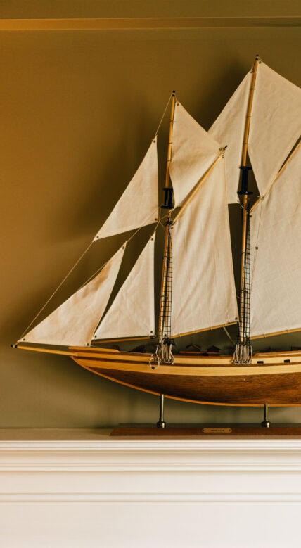 Sail boat model on a mantel at Niagara's Finest Hotels in Niagara-on-the-Lake.