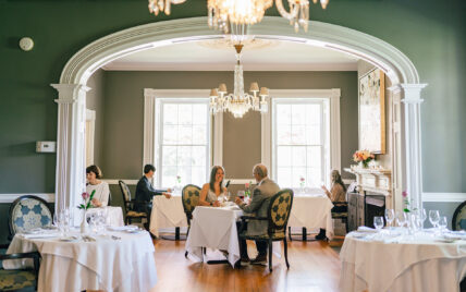 A couple in a dining room in one of Niagara's Finest Hotels in Niagara-on-the-Lake.