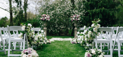 A wedding aisle with flowers along the sides at the Charles Hotel in Niagara-on-the-Lake.