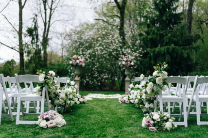 A wedding aisle with flowers along the sides at the Charles Hotel in Niagara-on-the-Lake.