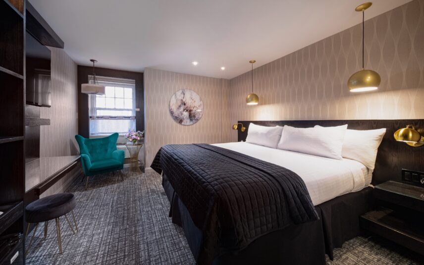 Wide view of a classic king room at the Shaw Club in Niagara-on-the-Lake.