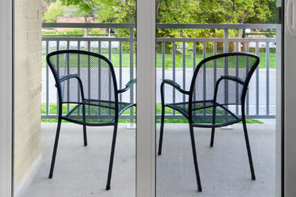 Chairs on a balcony in a deluxe king room at the Shaw Club in Niagara-on-the-Lake.