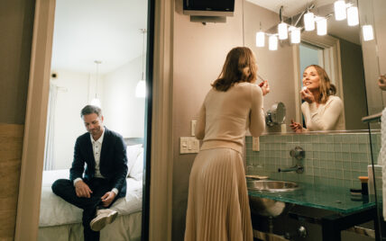 A woman putting on makeup in a washroom at the Shaw Club in Niagara-on-the-Lake.