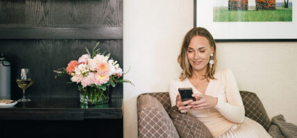 A woman on her phone at the Shaw Club in Niagara-on-the-Lake.