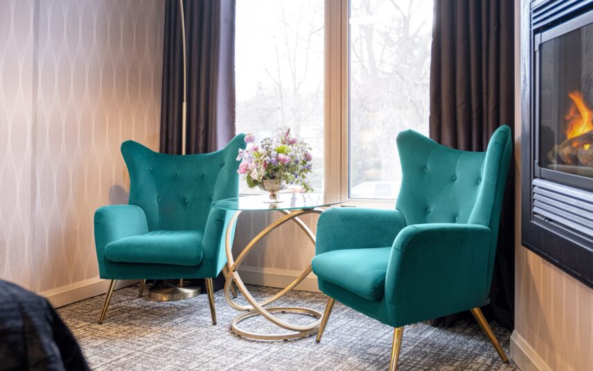 A deluxe king room with a fireplace at the Shaw Club in Niagara-on-the-Lake.