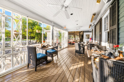 An outdoor covered porch at the Shaw Club in Niagara-on-the-Lake.