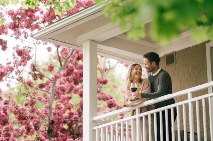 A couple on a porch at the Shaw Club hotel in Niagara-on-the-Lake.