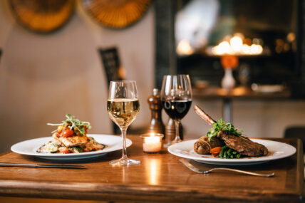 Dinner plates with wine on a table at the Shaw Club in Niagara-on-the-Lake.