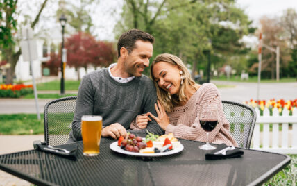 A couple eating food outdoors at the Shaw Club in Niagara-on-the-Lake.