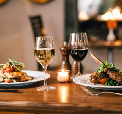 Glasses of wine beside food at the Shaw Club in Niagara-on-the-Lake.