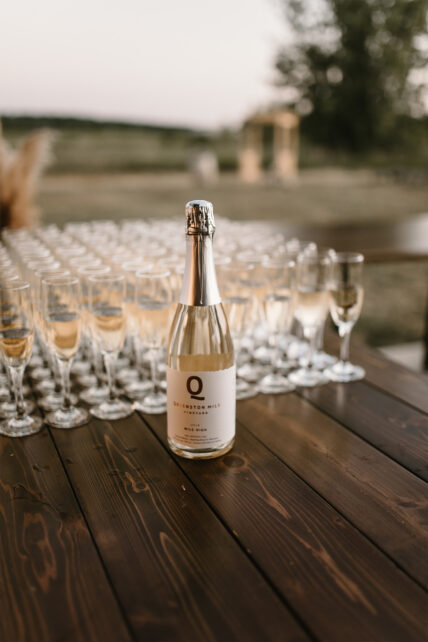 Champagne poured to toast to the newlyweds at Queenston Mile Vineyard in Niagara on the Lake