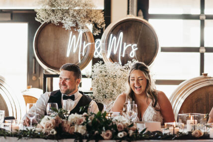 A couple enjoying their wedding reception at Queenston Mile Vineyard, a winery wedding venue