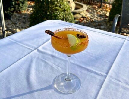 Apple Cider Margarita with apple slices, cinnamon stick, and dried star anise at the Hob Nob Restaurant in Niagara-on-the-Lake.