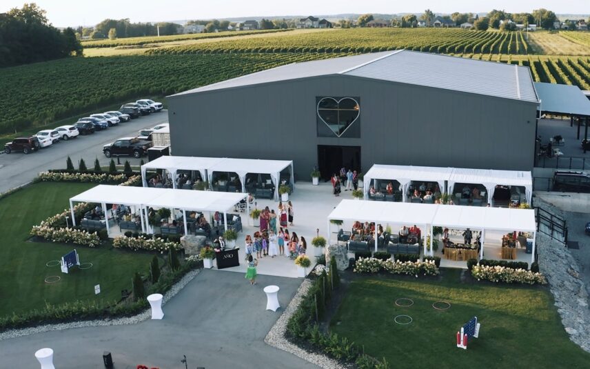 A reception in the outdoor cabanas wedding venue at Amo Estate Winery in Niagara on the Lake